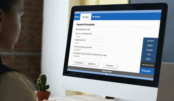 woman filling out online childcare registration forms in spanish