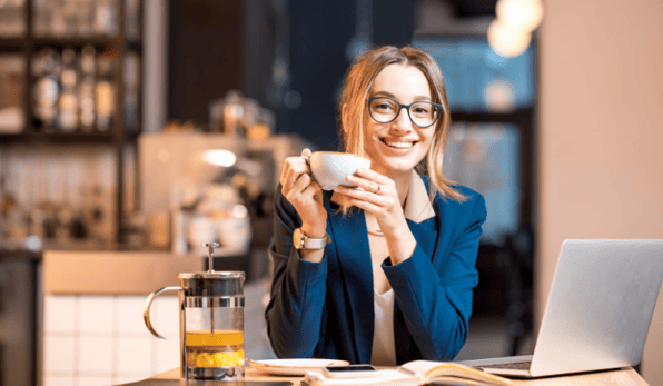 woman with laptop, drinking tea