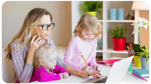 mom with kids on laptop and phone crop: how to start a daycare business plan
