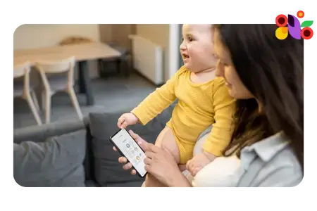 Mom holding baby while sending a text (1)